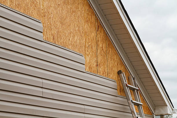 Professional Vinyl Siding technician working in Old Bethpage, NY
